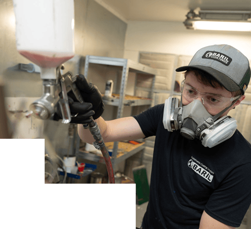 baril-employee-painting with paint gun