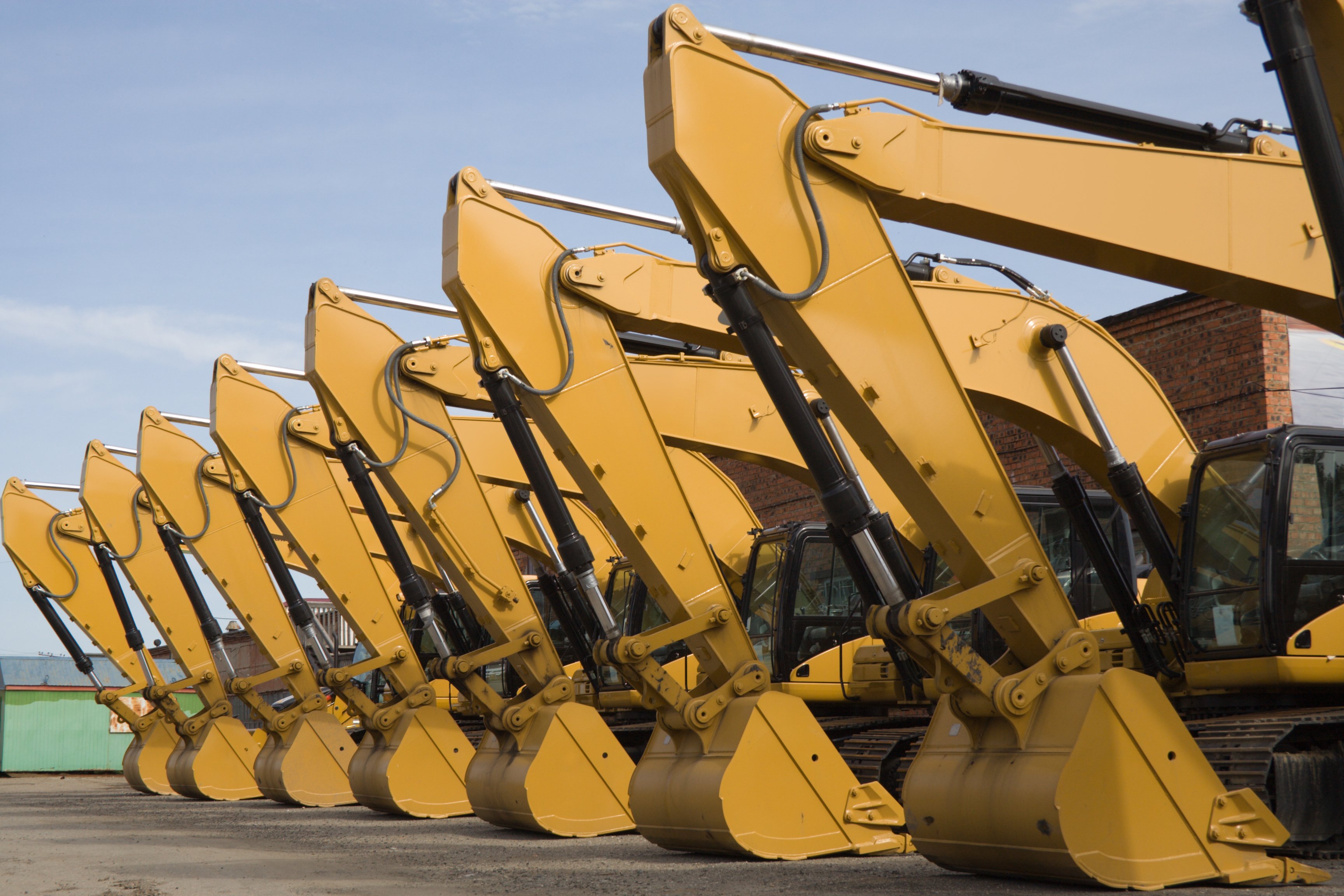 Row of yellow heavy earthmoving machinery