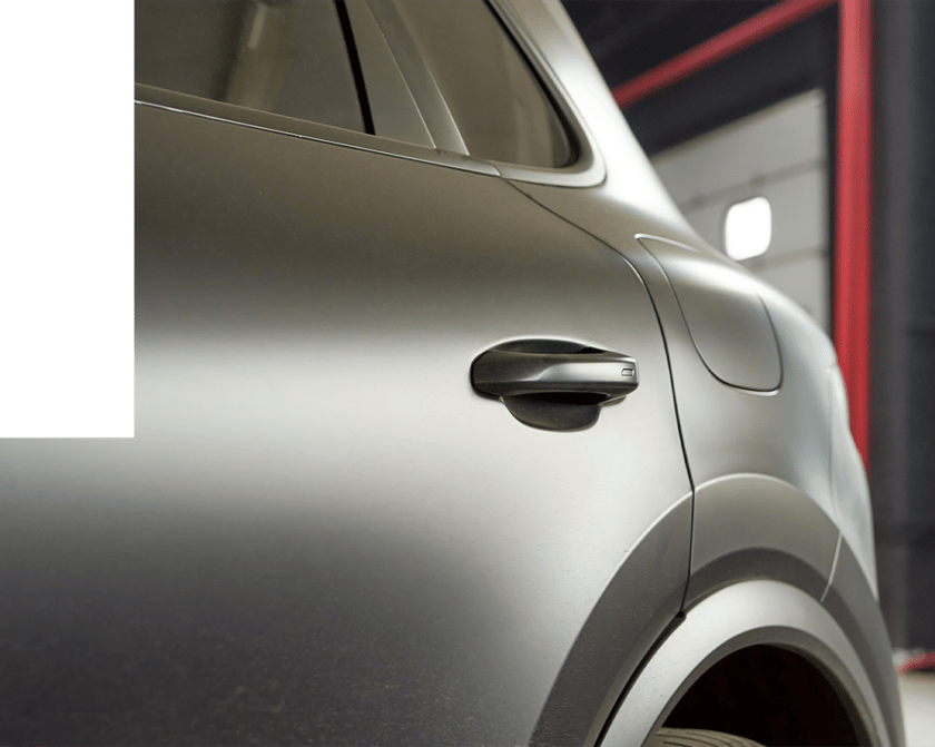 Silver car in body shop