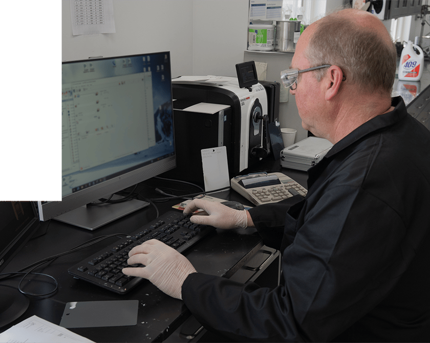 Lab employee working on computer