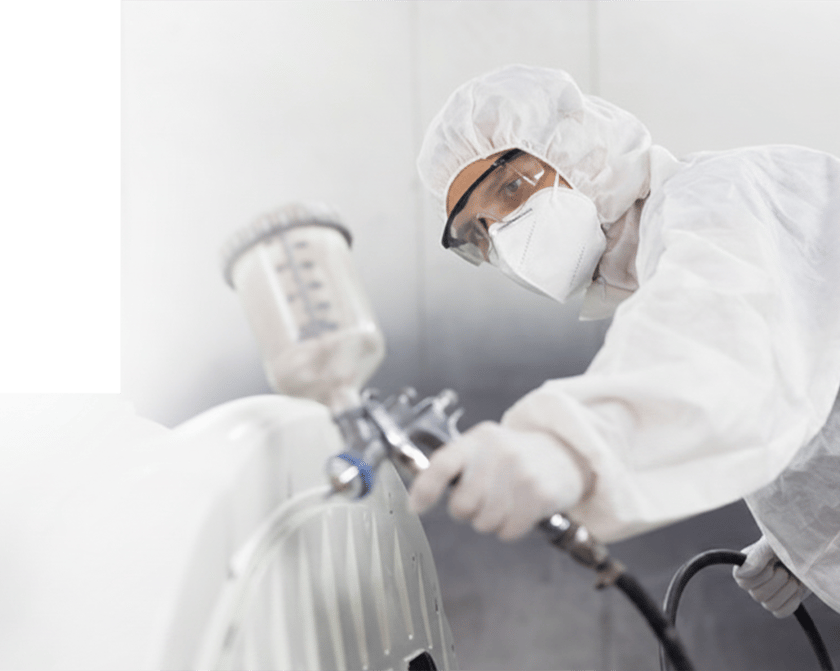 Man spraying white paint