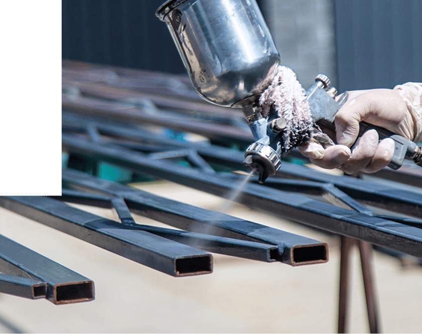 black paint being applied to grates