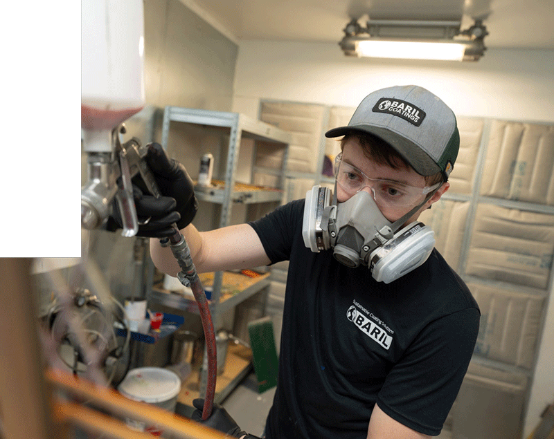 baril employee using paint applicator
