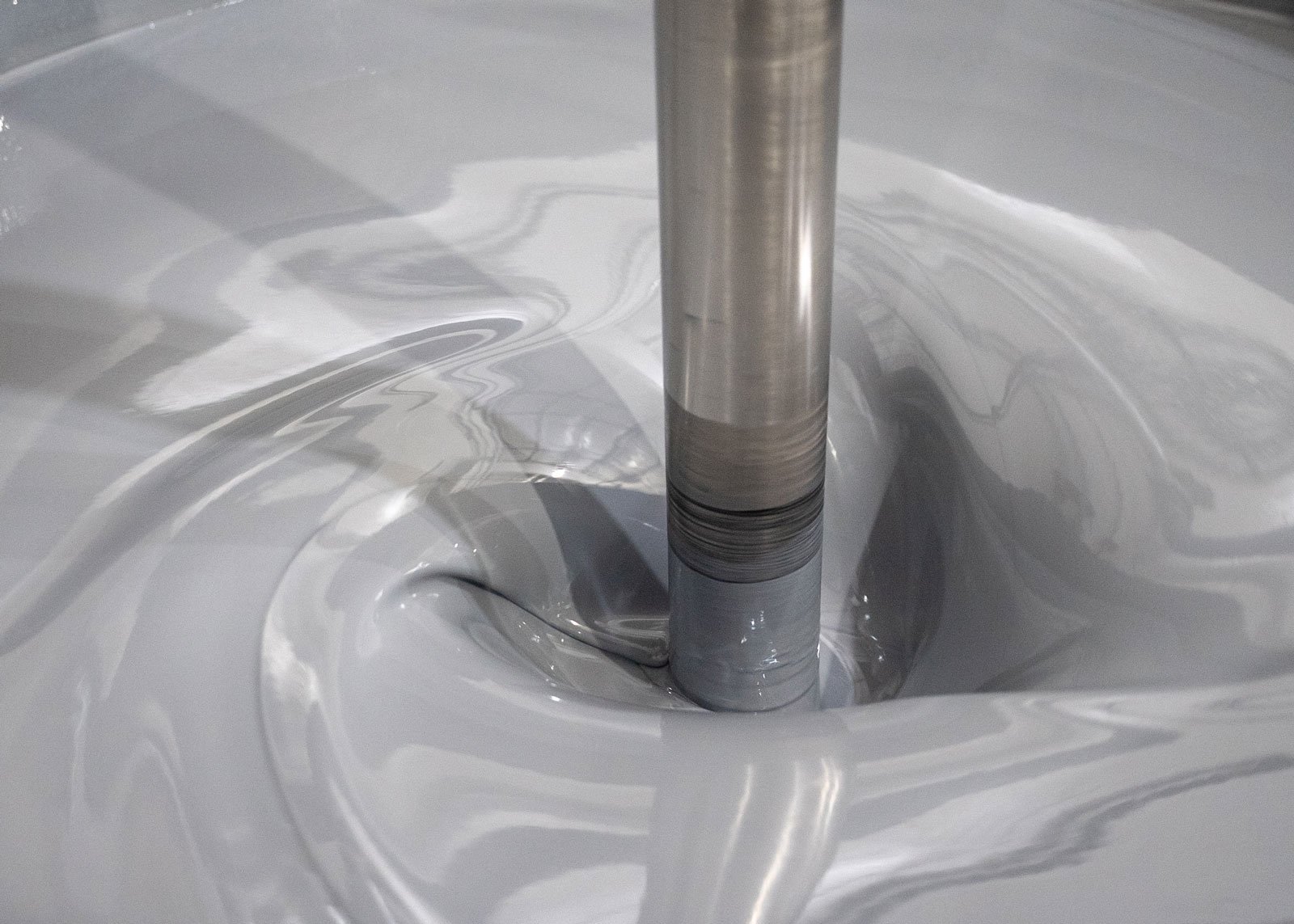 gray paint being mixed